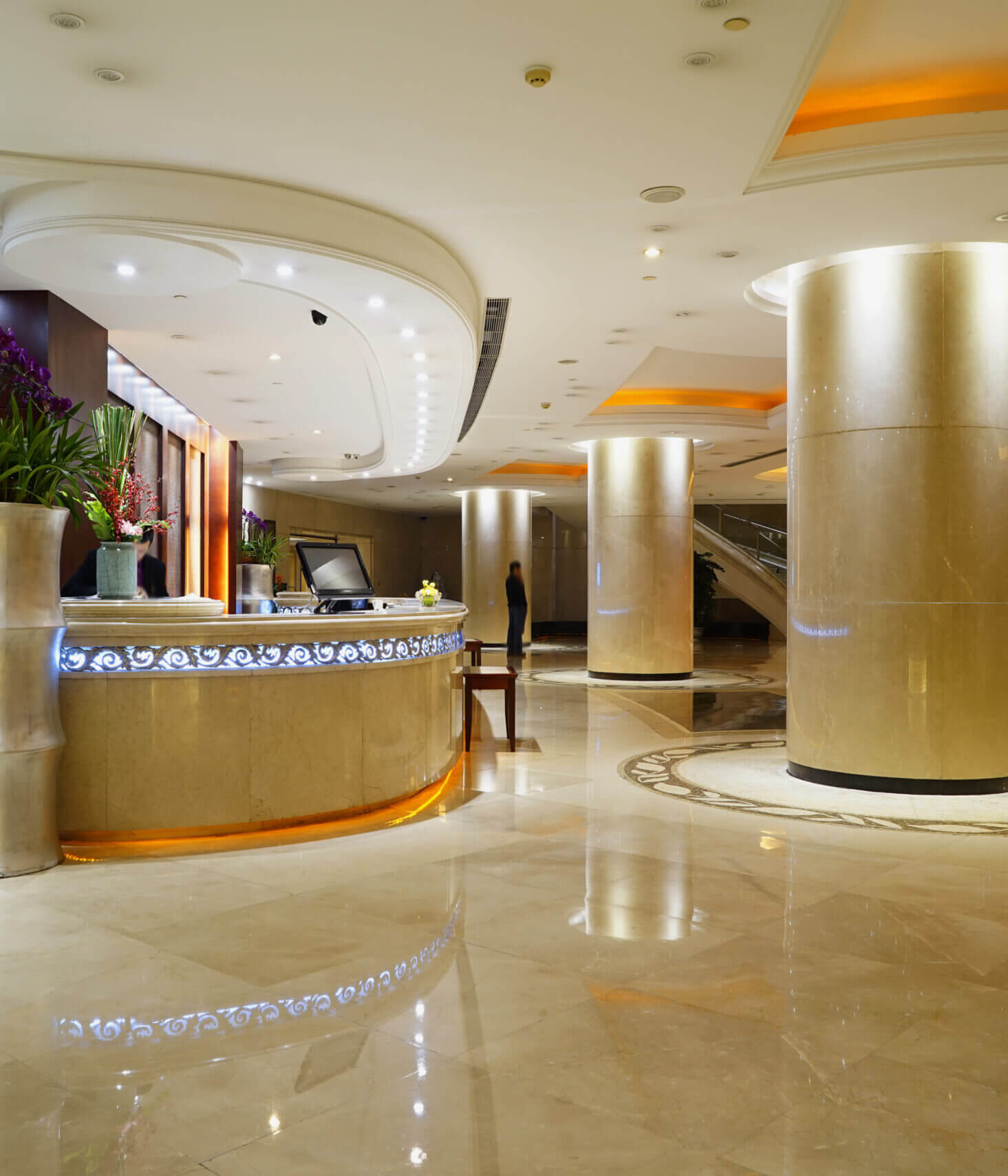 Elegant hotel lobby with polished marble floor.